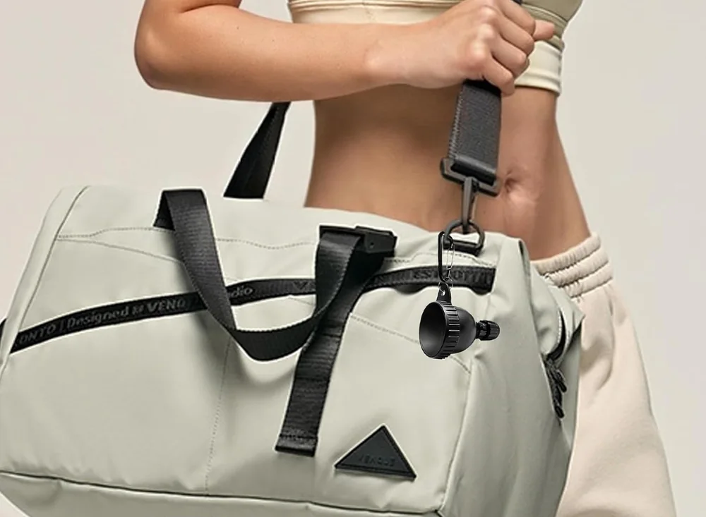 Illustration of a capped powder container clipped to a gym bag
